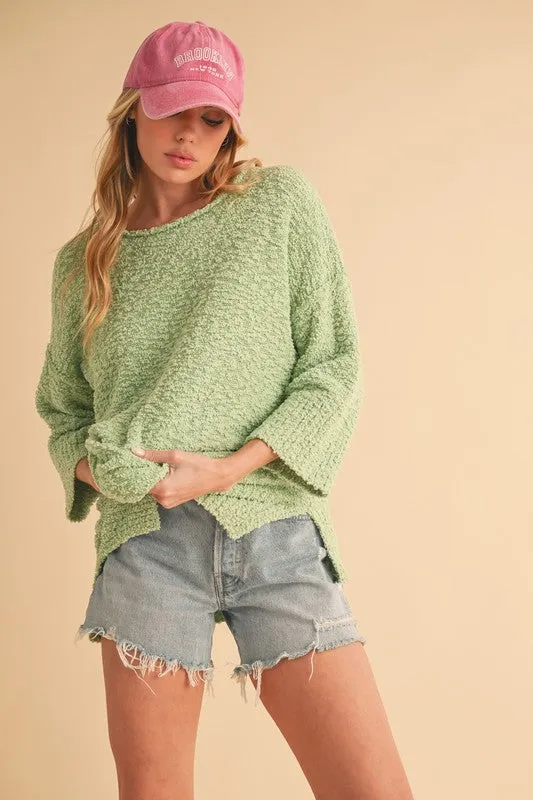Aemi   Co Side Slit Ribbed Hem Round Neck Sweater